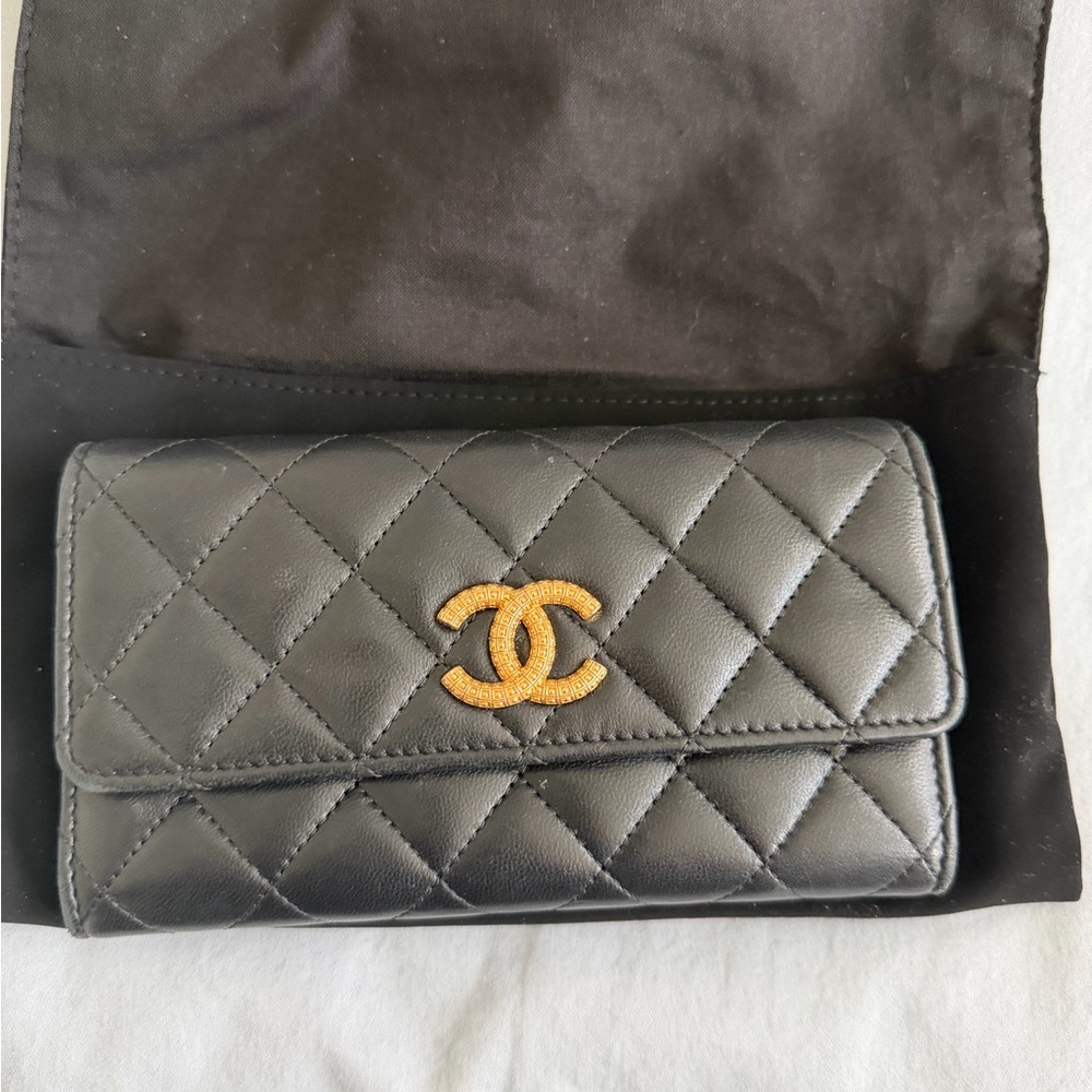 Chanel black quilted wallet with gold emblem